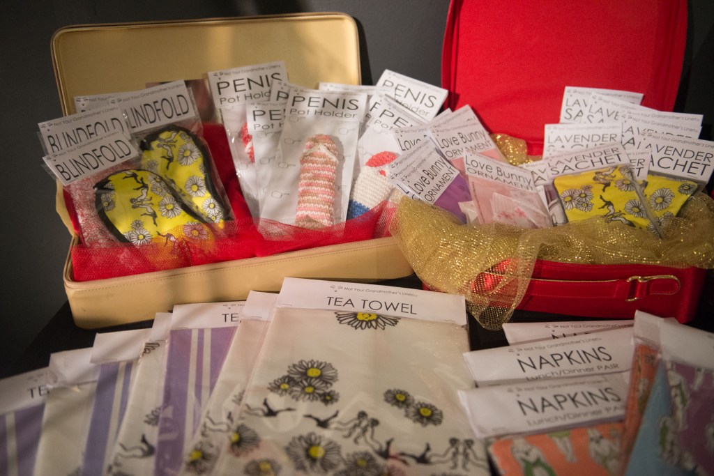 Many silly and sexy items for sale at the "XXX Shop" including prints of the art hanging in the gallery.