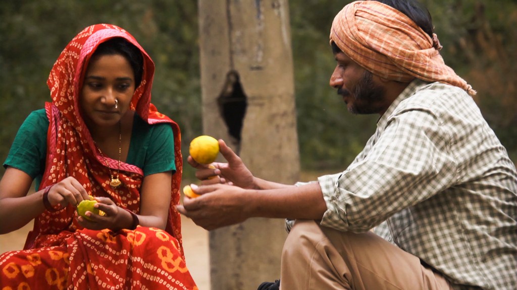 Worried parents Suman (Chatterjee) and Mahendra (Tailang) wait for their son to return.Zeitgeist Films