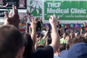 At 4:20 p.m., the crowd put their “O.K” hand signs up before smoking weed together. Photo by Anna Erickson