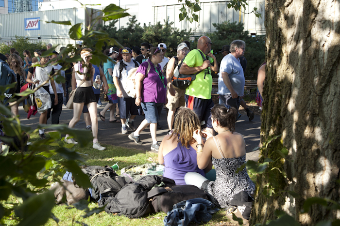 Festival attendees relax under a more shaded spot in Myrtle Edwards Park. Photo by Anna Erickson