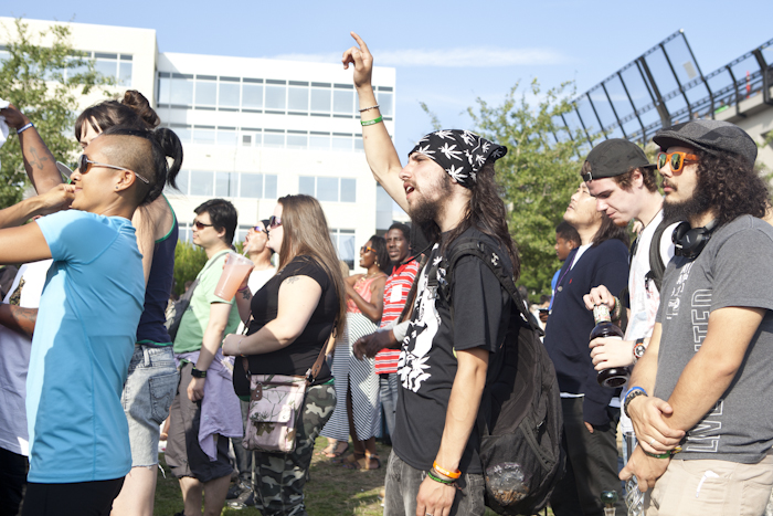 Cannabis advocates spoke inbetween musical sets to rally support for the festival. Photo by Anna Erickson