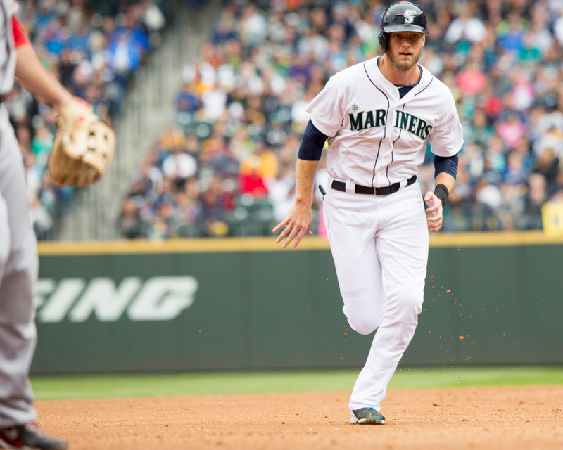 Michael Saunders sprints for third base