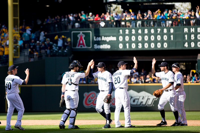 Seattle players trade high fives after the game ends.