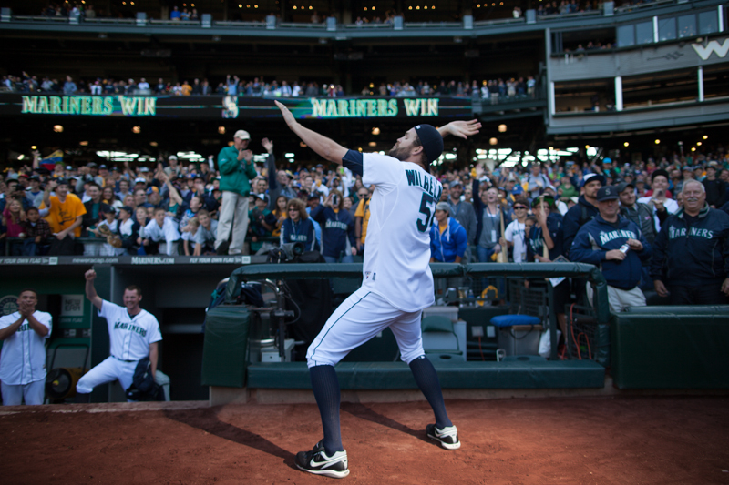 Seattle player Tom Wilhelmsen dances in front of fans after the game.