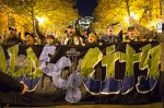 Fans sing support songs during a March to the Match rally before the game.