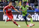 Seattle's Martins works past a Dallas FC player for a shot on goal in the first half.