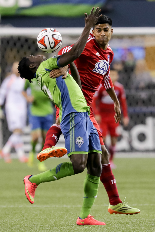 Martins, left, battles for control with a Dallas defender in the second half.