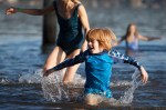 A young boy enjoys the cold waters of Lake Washington during the 2014 Polar Plunge.