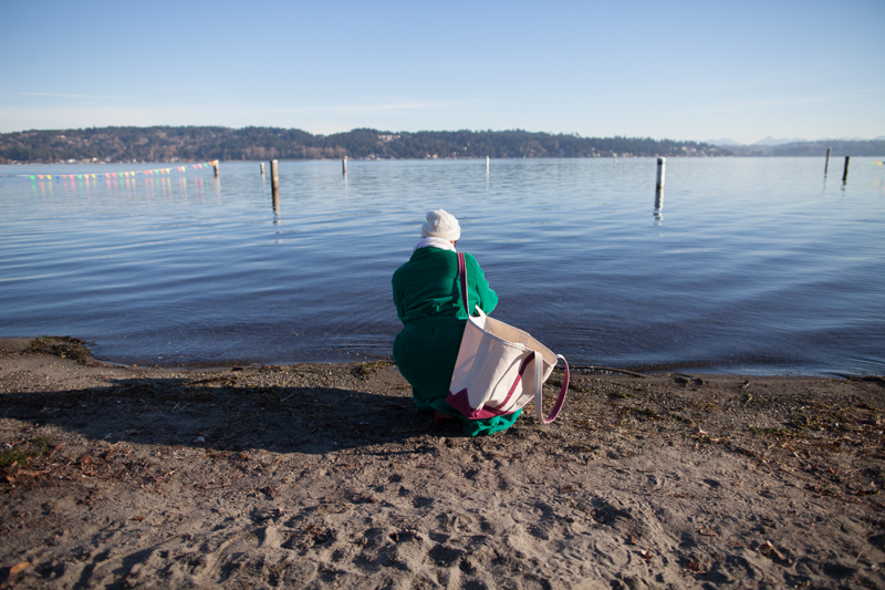 A woman gauges the temperature of the water ahead of the plunge.