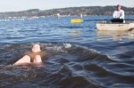 A woman surfaces after taking a dip.