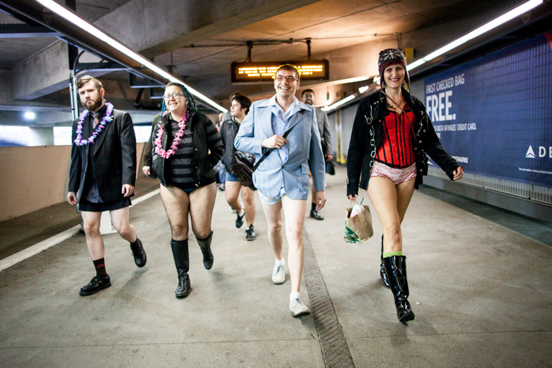 Participants walk into the SeaTac airport.
