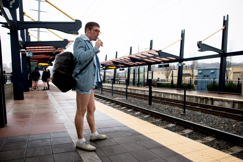 A rider awaits the next train at a station.