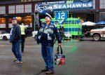 Mark Formanczyk of Puyallup takes a selfie in front of a 12th-man van before the game.