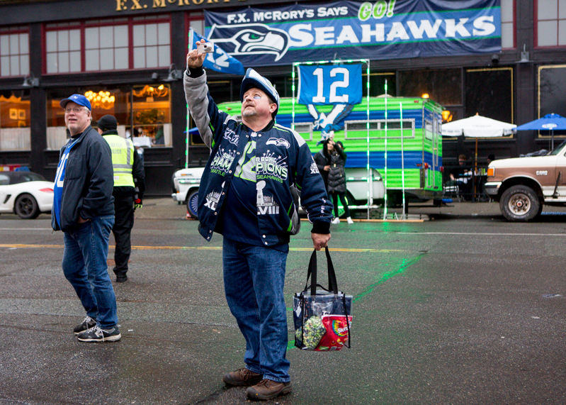 Mark Formanczyk of Puyallup takes a selfie in front of a 12th-man van before the game.