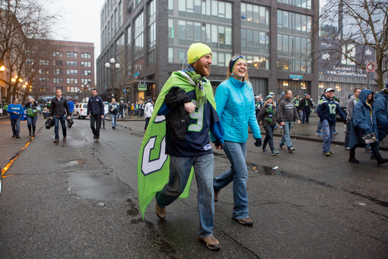 Fans walk to Century Link stadium before the game.