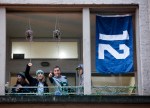 Fans cheer before the game.