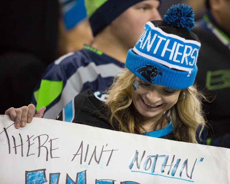 A Panthers fan readies her sign for action before the game.