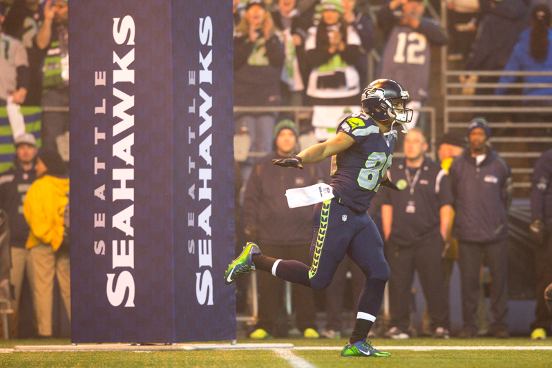 Hawks receiver Doug Baldwin does his trademark 'flight' onto the field.