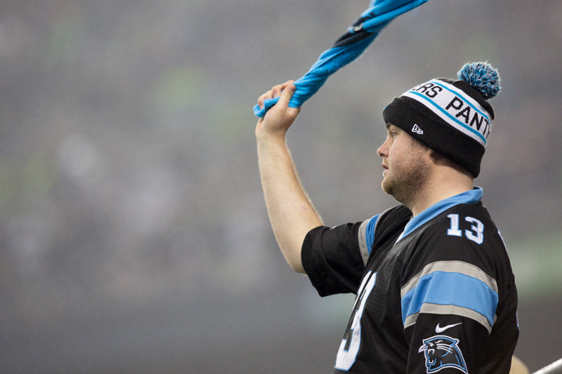 A Panther fan cheers on his team as the game begins.