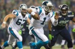 Panthers quarterback Cam Newton scrambles right for a 4 yard gain in the first quarter.