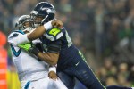 A Seattle defender lays a hit on Panthers' quarterback Cam Newton in the first quarter. Newton threw an incomplete on the play.