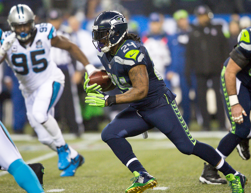 Seahawks' running back Marshawn Lynch powers upfield in the first quarter for a gain of 6 yards.