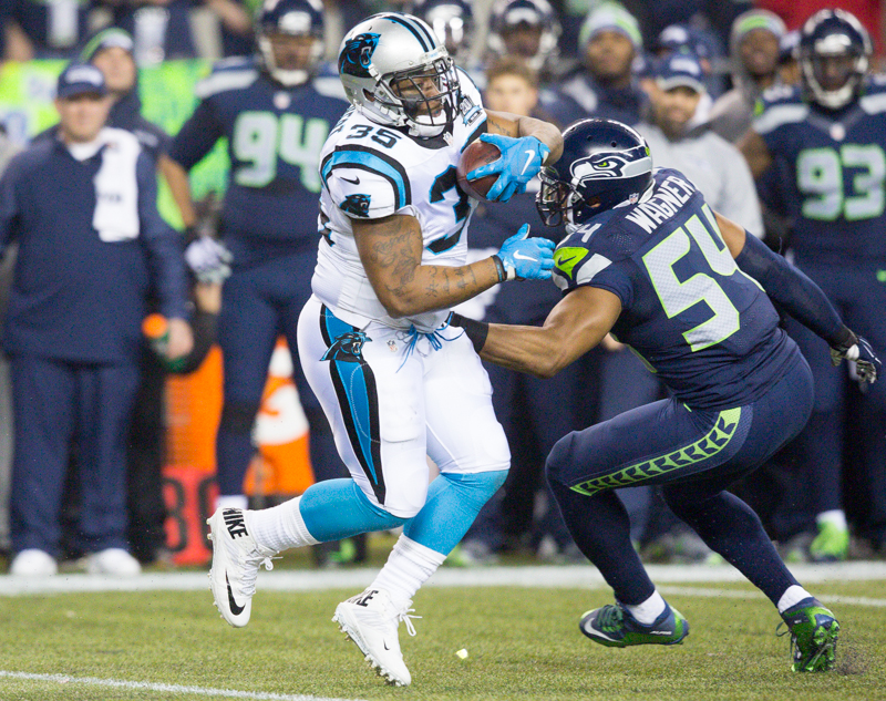 Panthers fullback Mike Tolbert rumbles upfield for a 16-yard gain in the first quarter.