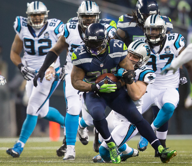 Marshawn Lynch tries to escapes the Carolina defense on a no gain run in the second quarter.