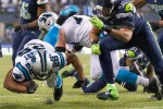 Panthers running back Jonathan Stewart picks up a gain in the second quarter.