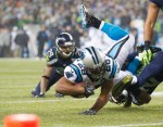 Panthers running back Jonathan Stewart picks up a gain in the second quarter.