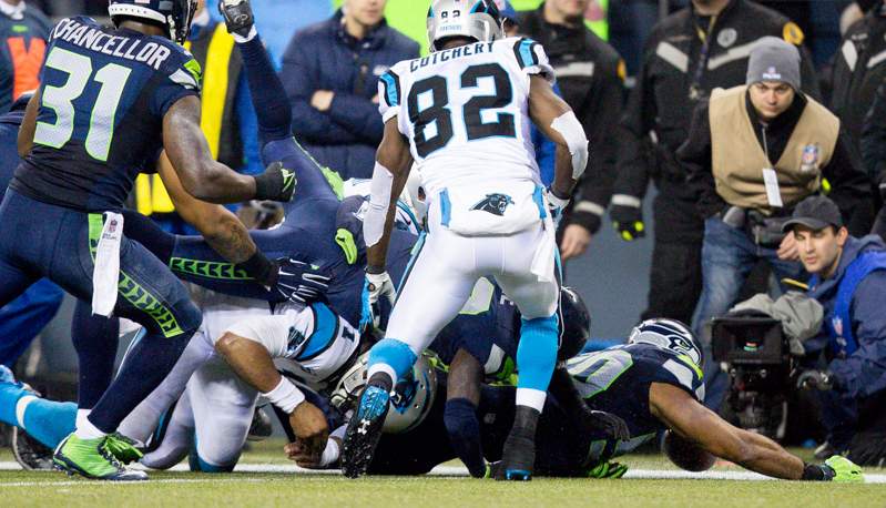 Players scramble for possession after Carolina fumbled the ball in the second quarter. The ball was ruled dead.