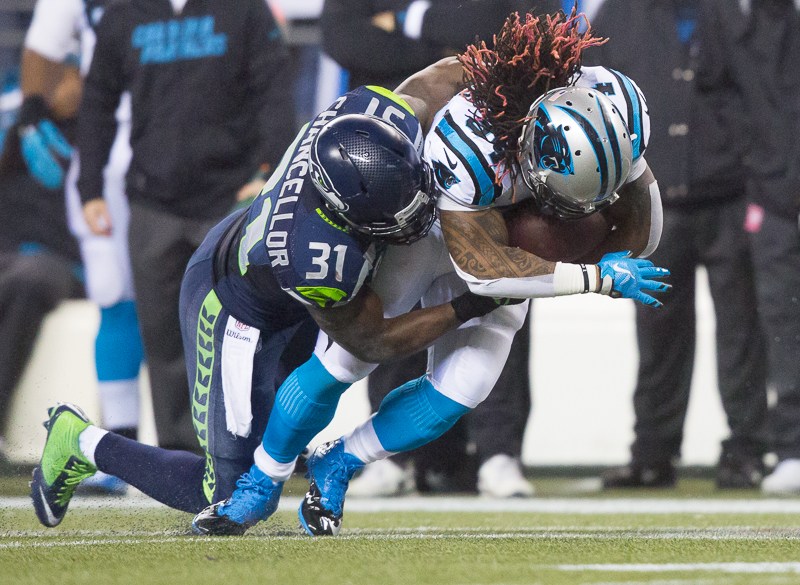 Seattle safety Kam Chancellor stuffs a Panther running back for a 2-yard gain in the second.