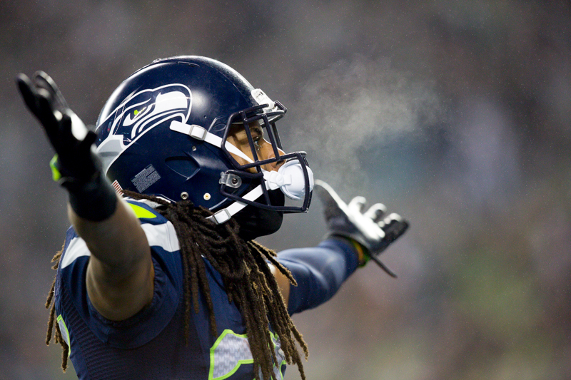 Seattle cornerback Richard Sherman celebrates on the field after shutting down the Panthers late drive to even up the score late in the second quarter.