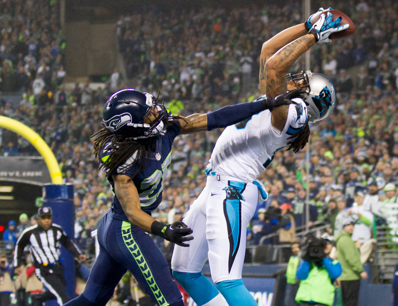 Richard Sherman helps to push an end-zone catch by a Panthers' receiver out of bounds in the second quarter.
