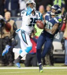 Seattle receiver Paul Richardson struggles to fend off a Panther receiver in the third quarter. Richardson was injured on the play and did not return in the game.