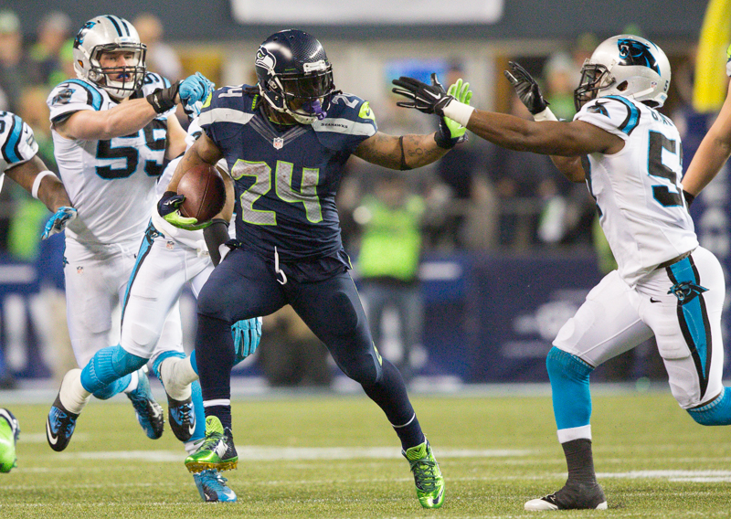 Marshawn Lynch breaks free of several Panther defenders for a 25-yard gain in the third quarter.