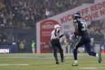 Kam Chancellor runs a pick back for a touchdown against the Panthers in last year's playoffs. Photo by Jeremy Dwyer-Lindgren