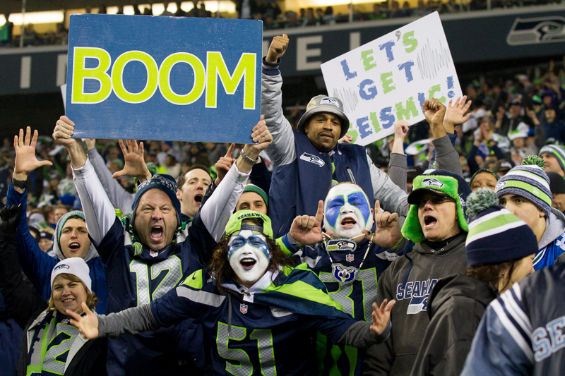 Fans cheer wildly after Kam Chancellor's game-ending interception in the fourth quarter.