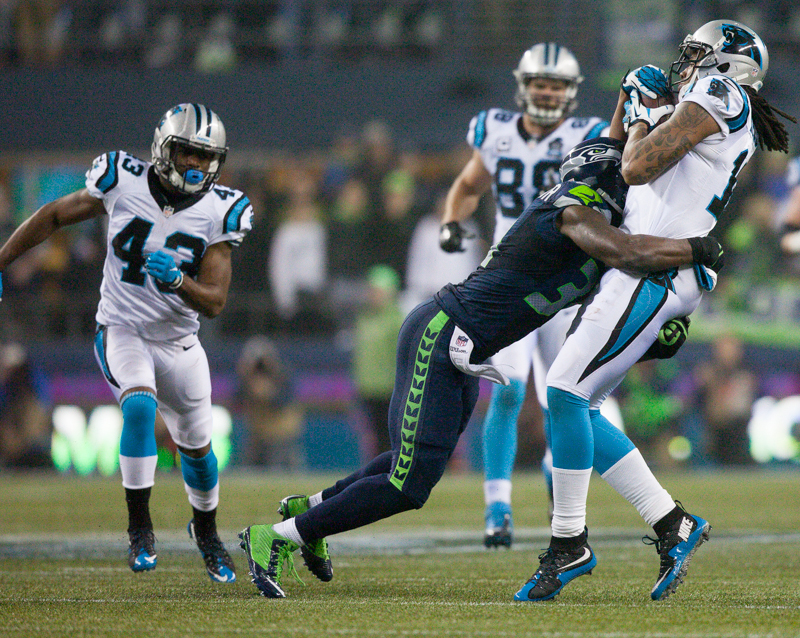 Panthers receiver Kelvin Benjamin is downed for a 28-yard gain late in the fourth quarter.