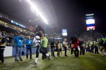 Richard Sherman waves to the crowd as he exits the field after his win.