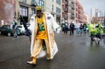 Ready for the game, a particularly flamboyant Packers fan walks the streets.