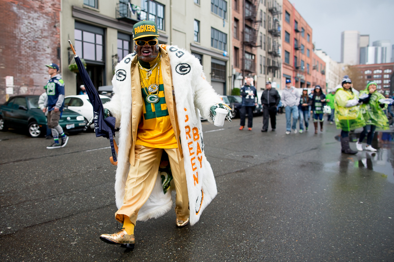 Ready for the game, a particularly flamboyant Packers fan walks the streets.