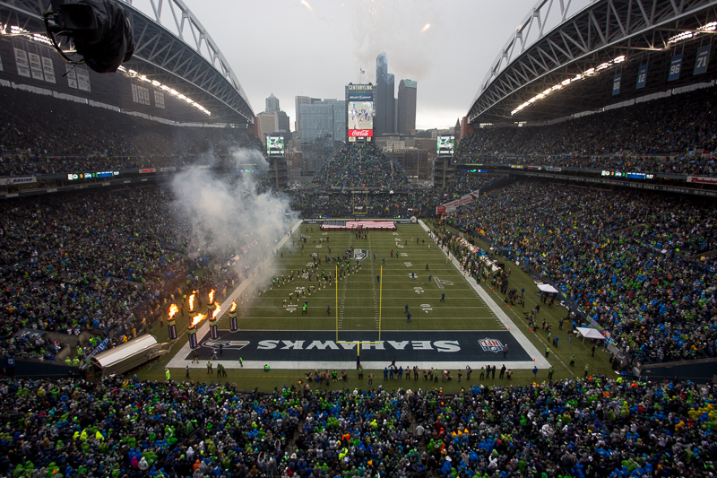 The stadium erupts with cheers as the team takes the field.