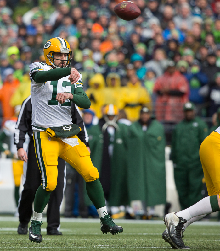 Green Bay quarterback Aaron Rodgers tosses a pass in the first quarter.