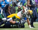 Green Bay receiver Richard Rodgers is taken down after a gain in the first quarter.