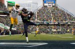Seattle cornerback Richard Sherman intercepts an end-zone pass intended for Davante Adams early in the first quarter.