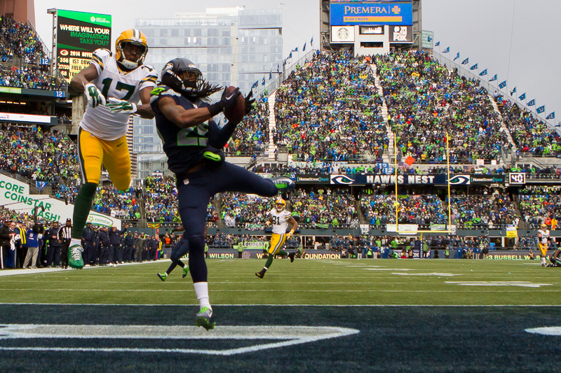 Seattle cornerback Richard Sherman intercepts an end-zone pass intended for Davante Adams early in the first quarter.