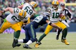 Green Bay receiver Randall Cobb blocks a tackle in the second quarter.