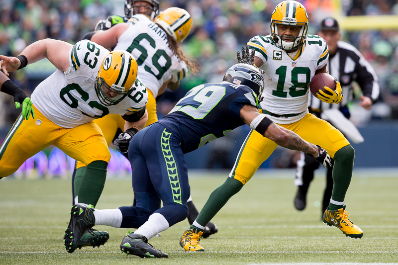 Green Bay receiver Randall Cobb blocks a tackle in the second quarter.