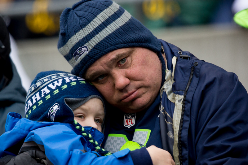 The future of the Seahawks' season in apparent jeopardy, a father-son duo console one another at the end of the half.